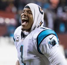 Cam Newton qui protège mieux ses droits de balle